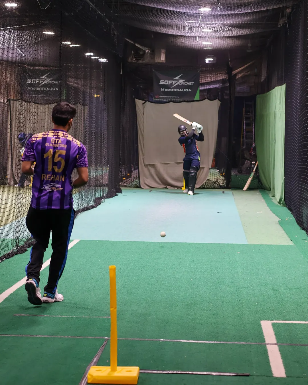 Players training in the nets at a SOFF indoor cricket facility